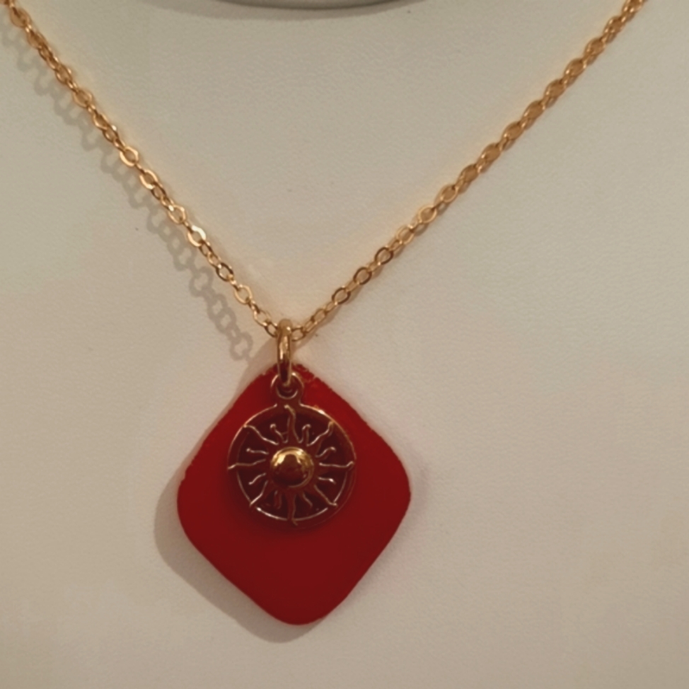 Red Stained Glass Necklace With A Sun Charm